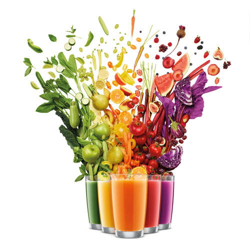 Fresh fruit and vegetables juiced into colorful glasses of juice.
