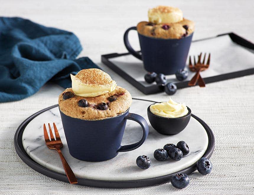 Vanilla Blueberry Mug Cake with Cream Cheese Icing